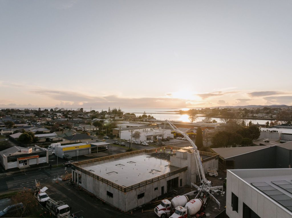Regor boom pump on a commercial slab pour in the Devonport CBD at sunrise
